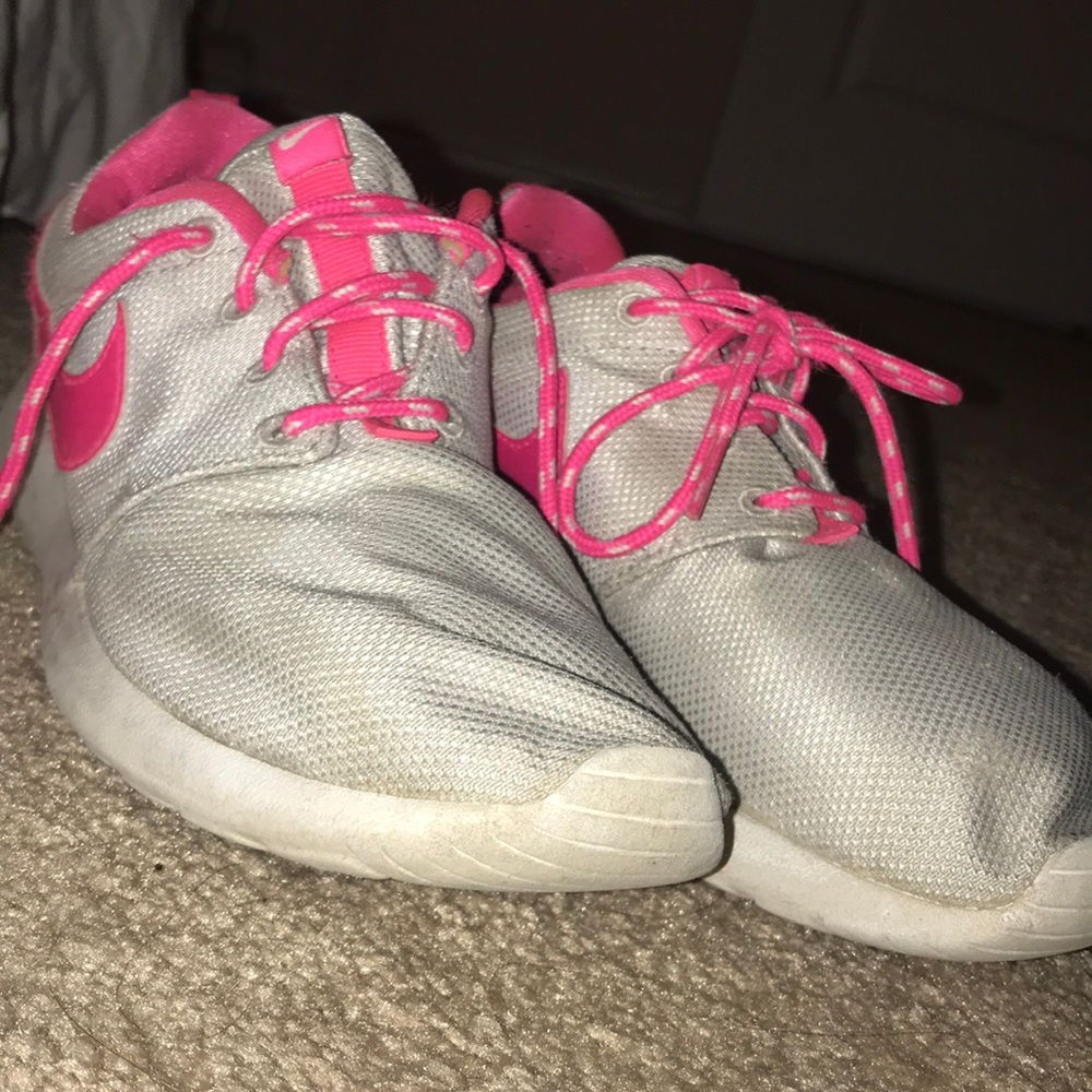 Pink and grey Nike roshes